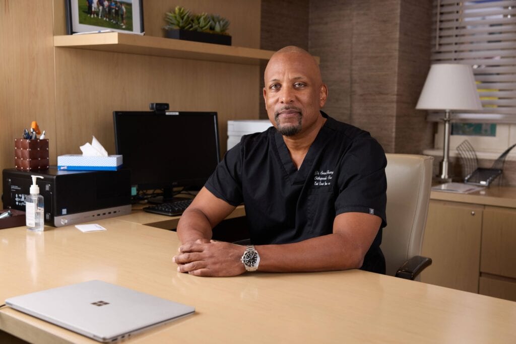 Dr. Sean Thompson seated in his office